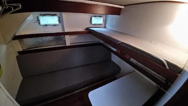 Slide: The Image of Interior cabin of 2007 Custom Rockport Steel Trawler MY with bunk beds and seating. - 43