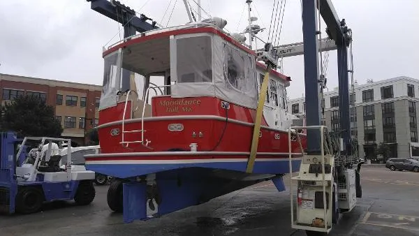 Slide: The Image of Custom 2007 Rockport Steel Trawler MY being lifted by a boat hoist. - 9