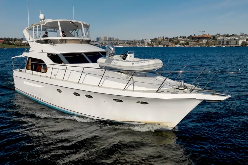 Slide: The Image of 2003 Ocean Alexander 48 Sedan yacht cruising on the water. - 1
