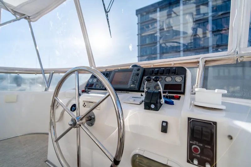 Slide: The Image of Ocean Alexander 48 Sedan 2003 yacht helm with navigation equipment and steering wheel. - 10