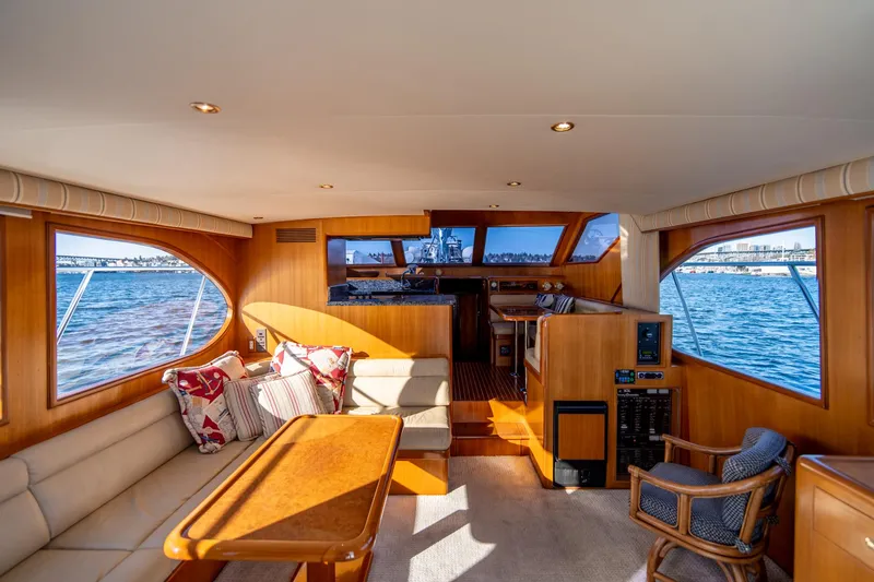 Slide: The Image of Interior of 2003 Ocean Alexander 48 Sedan yacht with panoramic windows and elegant furnishings. - 11