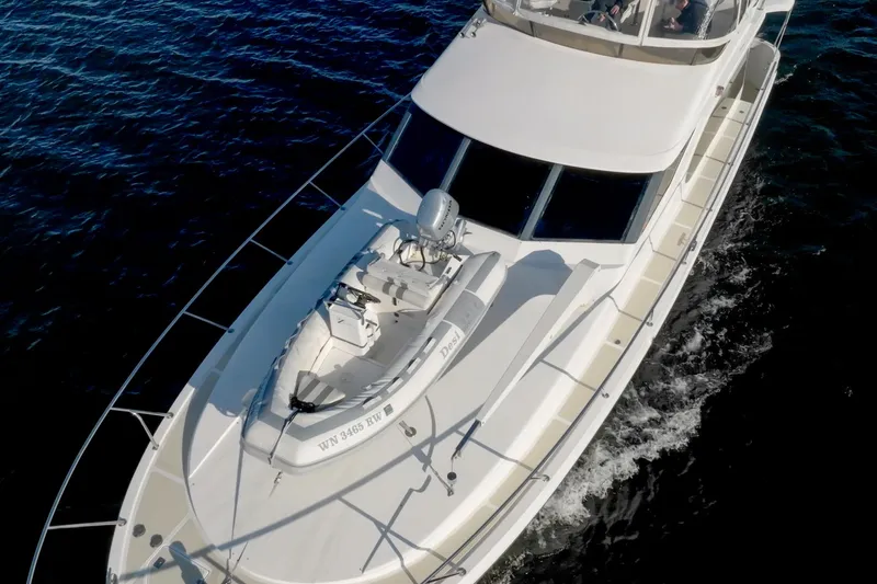Slide: The Image of 2003 Ocean Alexander 48 Sedan cruising on the water. - 2