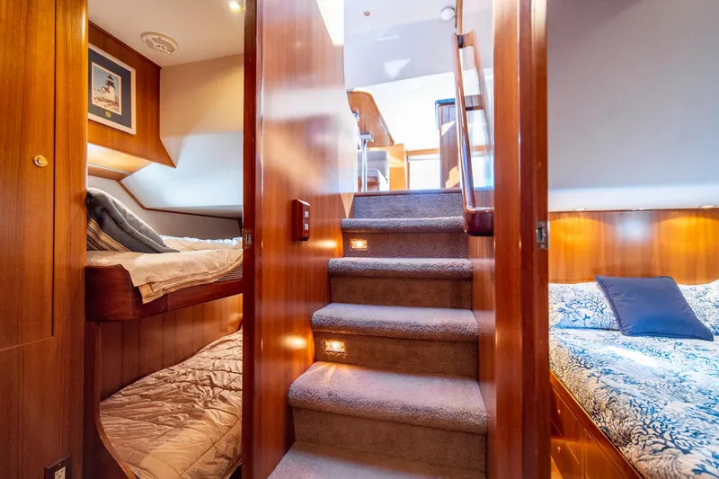 Slide: The Image of Interior of 2003 Ocean Alexander 48 Sedan yacht with cozy bedrooms and carpeted stairs. - 22