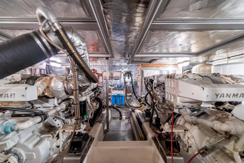 Slide: The Image of Engine room of a 2003 Ocean Alexander 48 Sedan yacht with Yanmar engines. - 27