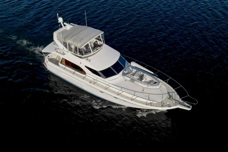 Slide: The Image of 2003 Ocean Alexander 48 Sedan cruising on open water. - 3
