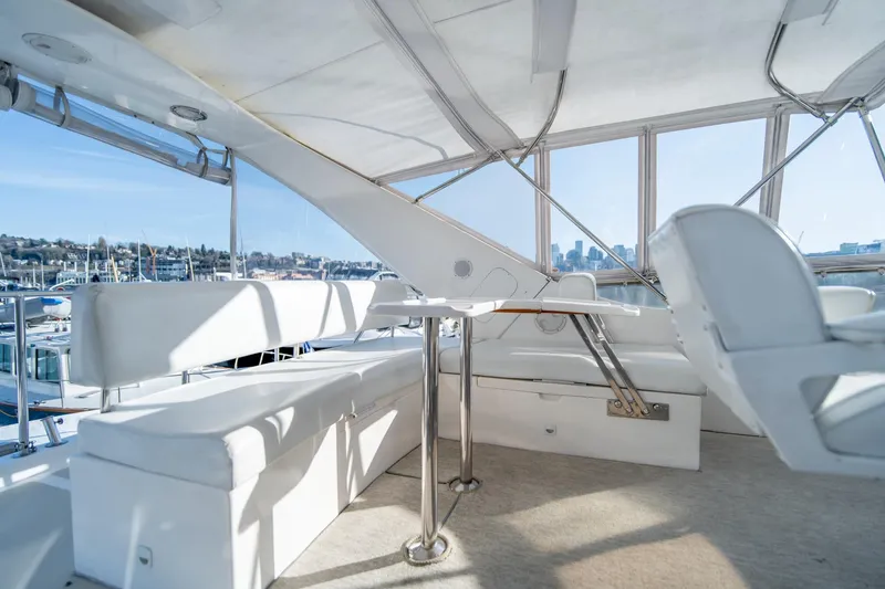 Slide: The Image of Flybridge seating area on a 2003 Ocean Alexander 48 Sedan yacht. - 8