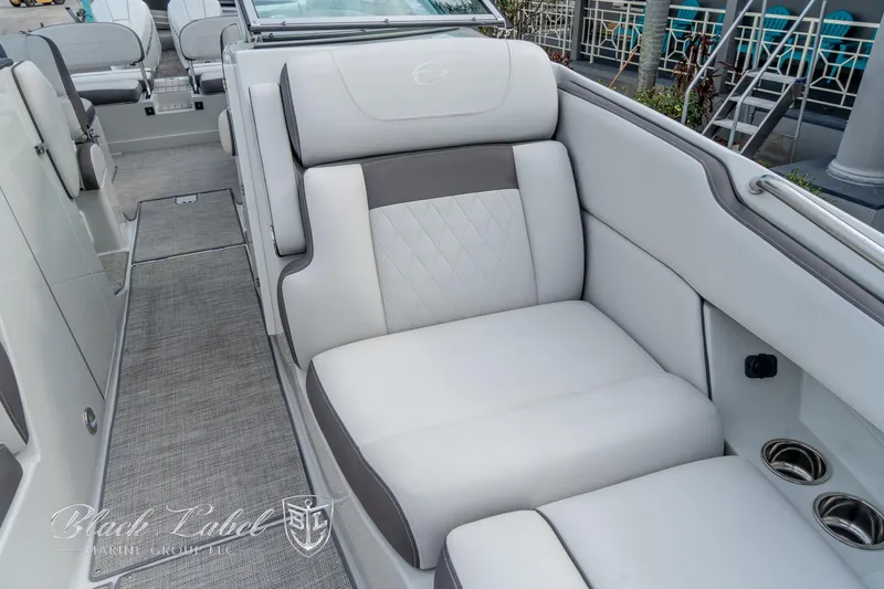 Slide: The Image of 2024 Crownline E305 XS boat interior with luxurious seating and modern design. - 10