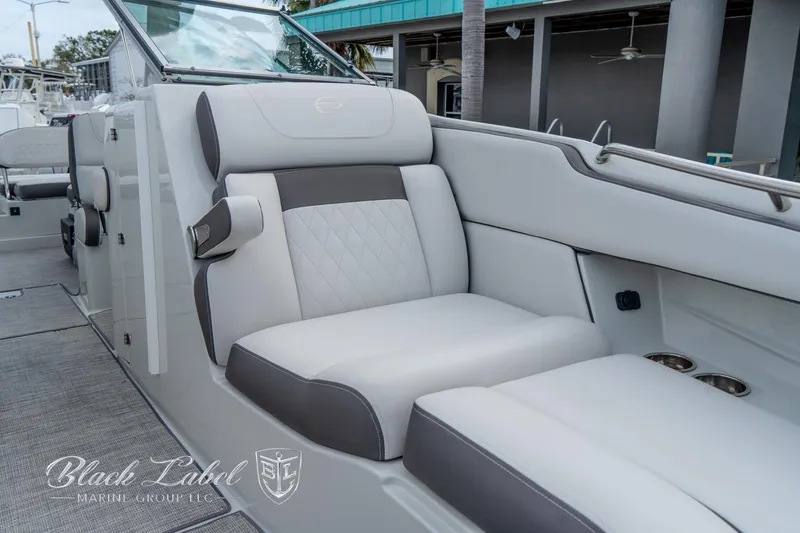 Slide: The Image of 2024 Crownline E305 XS boat interior with luxurious seating and modern design. - 12