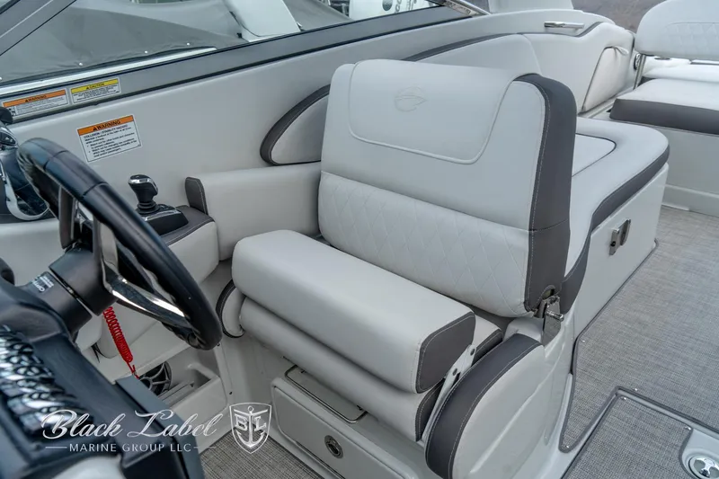Slide: The Image of 2024 Crownline E305 XS boat interior with luxurious seating and modern design. - 14