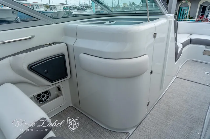 Slide: The Image of 2024 Crownline E305 XS boat interior with sleek design and modern amenities. - 17