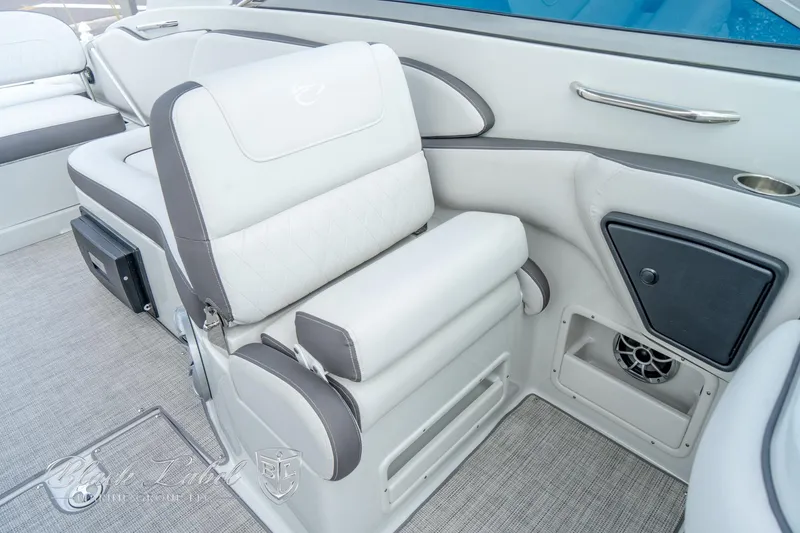 Slide: The Image of 2024 Crownline E305 XS boat interior with plush seating and modern design. - 19