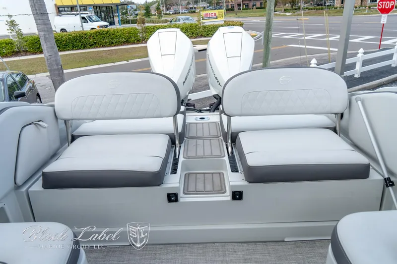 Slide: The Image of 2024 Crownline E305 XS boat with dual seating and modern design. - 31