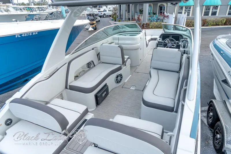 Slide: The Image of 2024 Crownline E305 XS boat interior with spacious seating and modern design. - 34