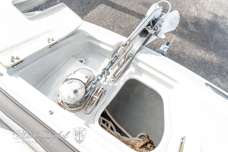 Slide: The Image of 2024 Crownline E305 XS boat anchor system and storage compartment. - 9