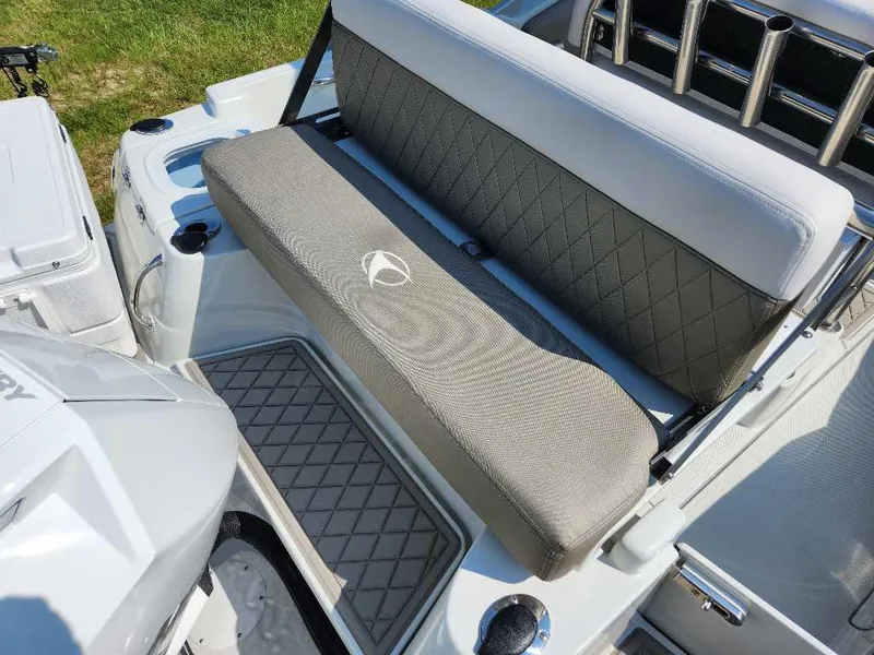 Slide: The Image of 2024 Finseeker 210 FinSeeker boat interior with cushioned seating and storage compartments. - 10