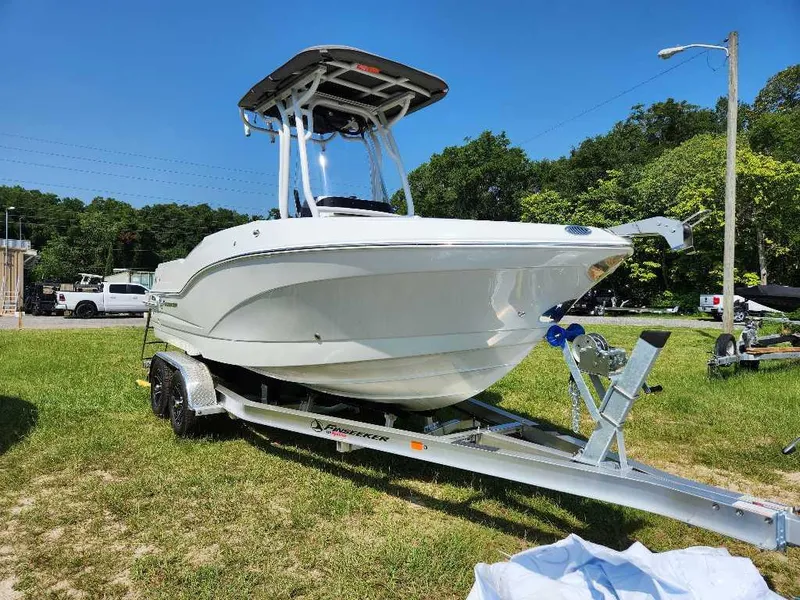 Slide: The Image of 2024 Finseeker 210 FinSeeker boat on trailer in outdoor setting. - 12