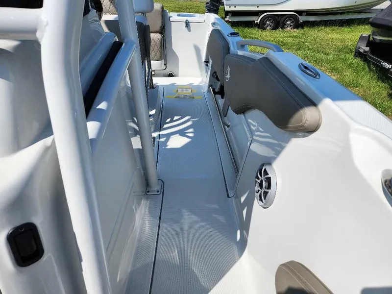 Slide: The Image of 2024 Finseeker 210 FinSeeker boat interior with seating and speaker. - 2