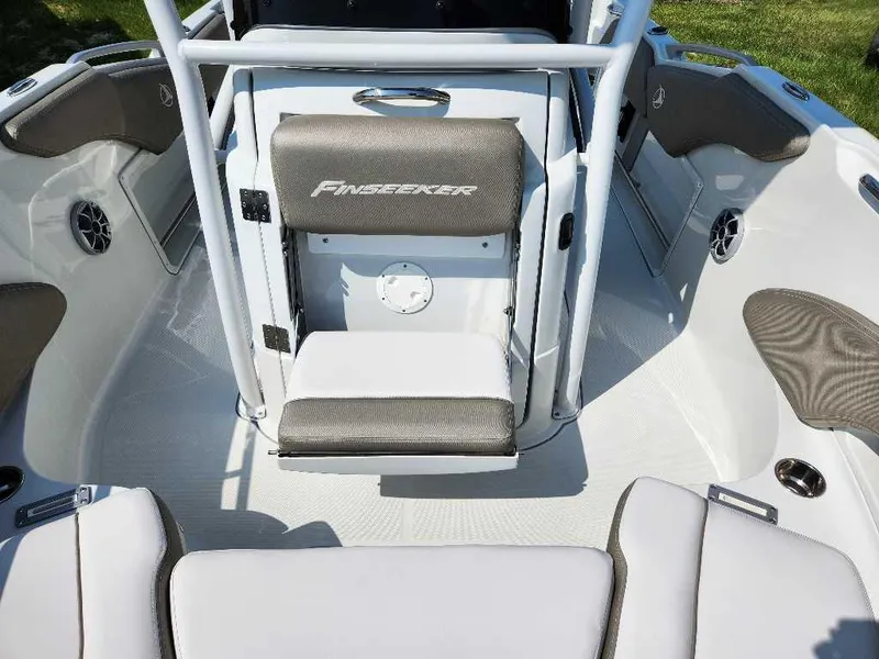 Slide: The Image of 2024 Finseeker 210 FinSeeker boat interior with seating and storage compartments. - 7