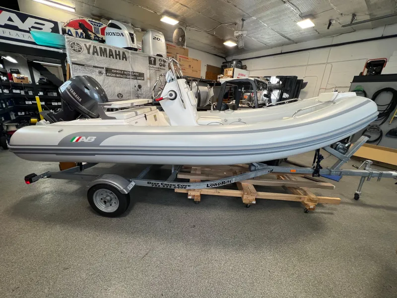 Slide: The Image of 2024 AB Inflatables 15 OCEANUS VST boat on trailer in showroom. - 0