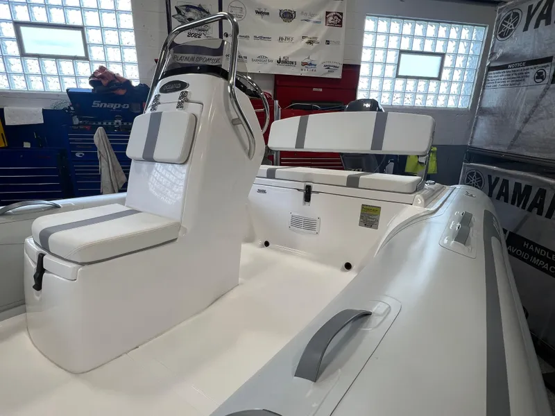 Slide: The Image of 2024 AB Inflatables 15 OCEANUS VST boat interior with seating and console. - 6
