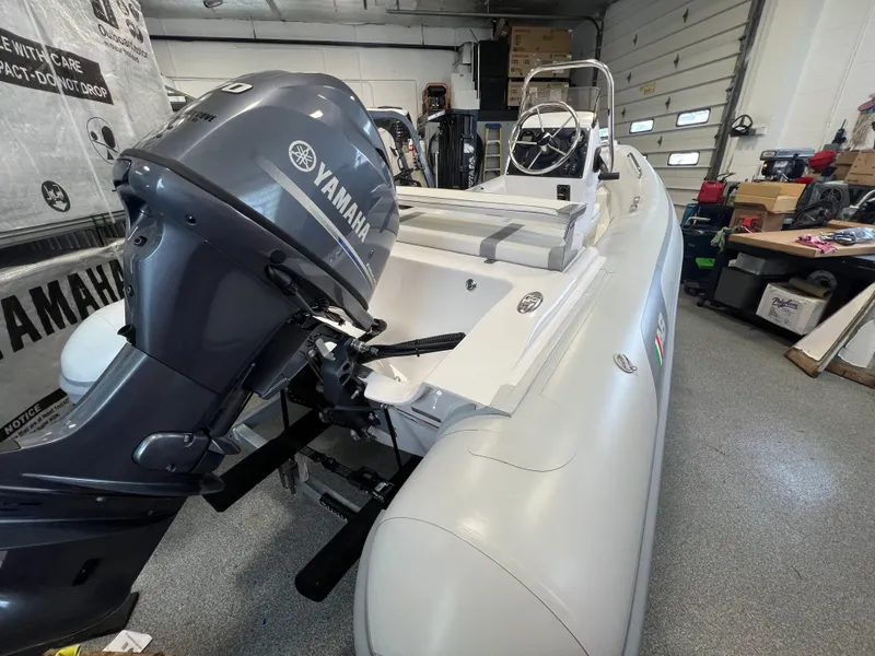 Slide: The Image of 2024 AB Inflatables 15 OCEANUS VST with Yamaha outboard motor in a garage. - 8