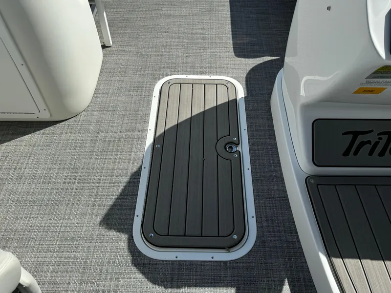 Slide: The Image of 2024 JC Neptoon Sport 23TT DSL boat deck with storage hatch and textured flooring. - 10