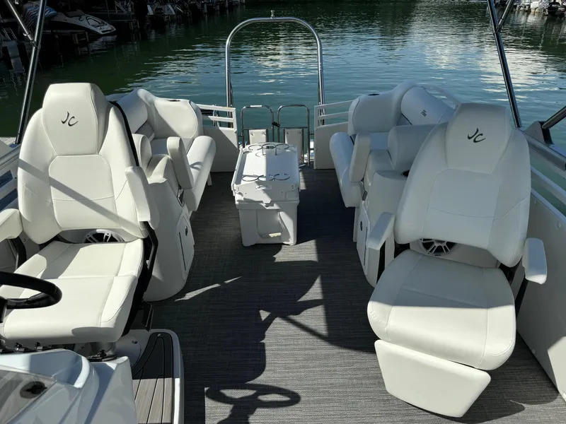 Slide: The Image of 2024 JC Neptoon Sport 23TT DSL pontoon boat with luxurious white seating and sleek design. - 13
