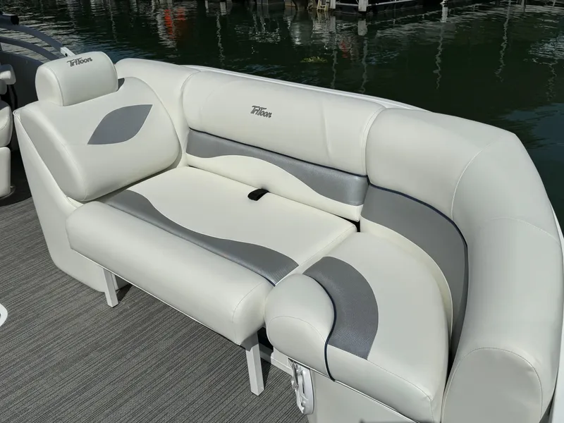 Slide: The Image of 2024 JC Neptoon Sport 23TT DSL boat seating with elegant white and gray upholstery. - 6