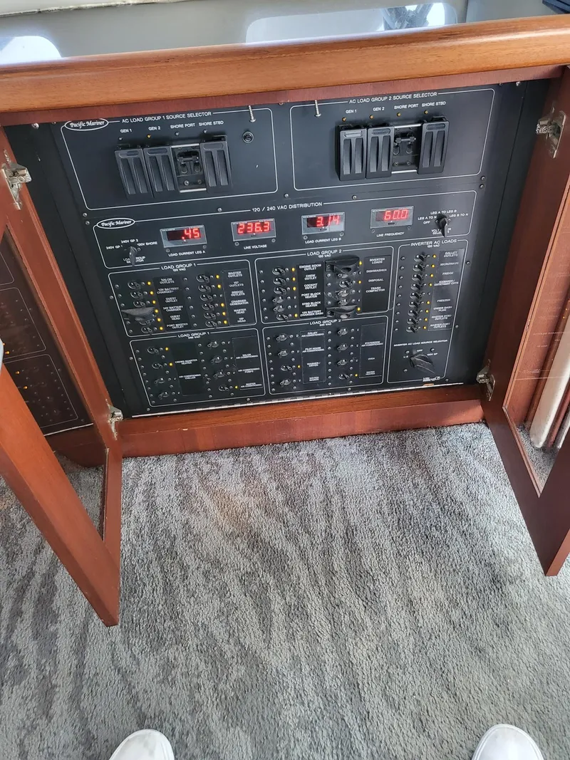 Slide: The Image of Control panel of a 2005 Pacific Mariner 65 SE Motoryacht with switches and indicators. - 10