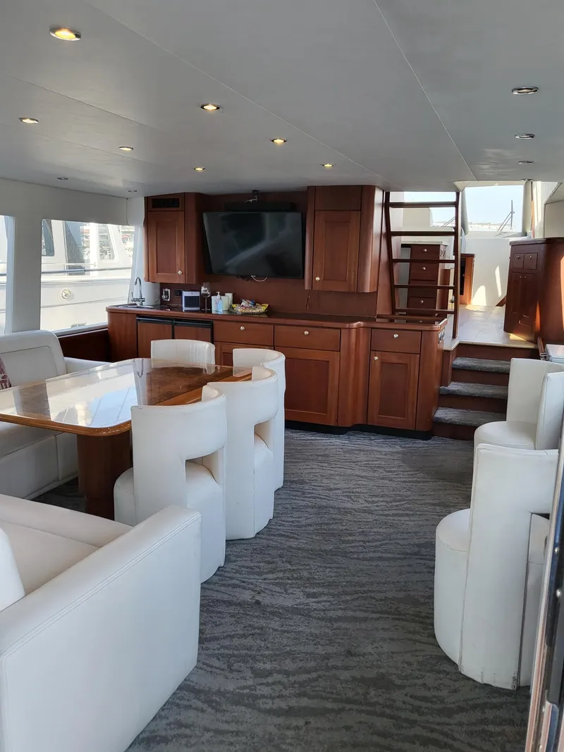 Slide: The Image of Luxurious interior of 2005 Pacific Mariner 65 SE Motoryacht with elegant seating and entertainment area. - 2