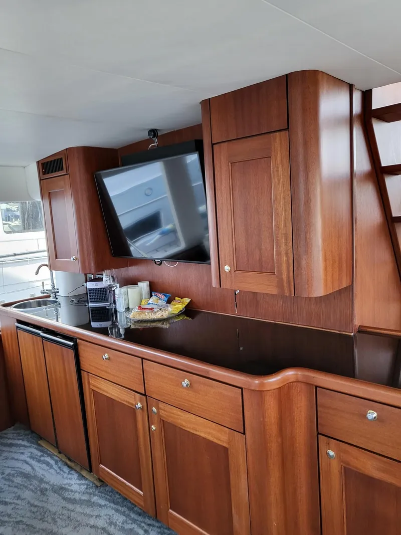 Slide: The Image of Luxurious interior of a 2005 Pacific Mariner 65 SE Motoryacht with wood cabinetry and modern amenities. - 3