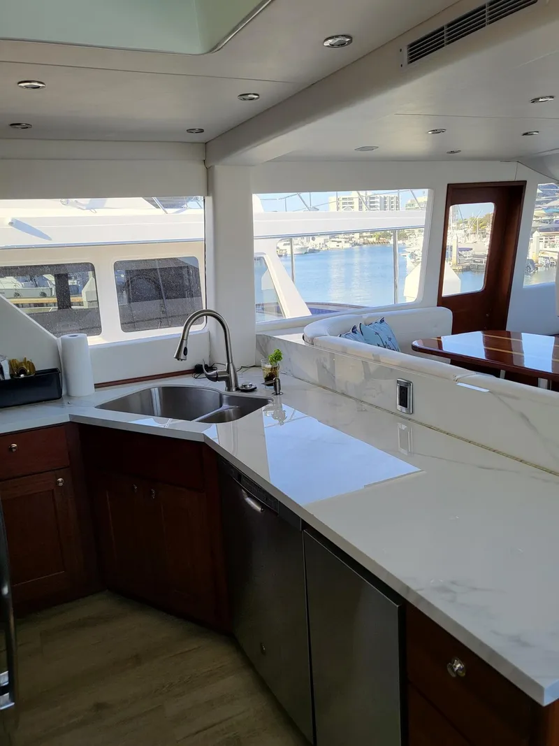 Slide: The Image of Luxurious kitchen interior of 2005 Pacific Mariner 65 SE Motoryacht with modern amenities. - 6