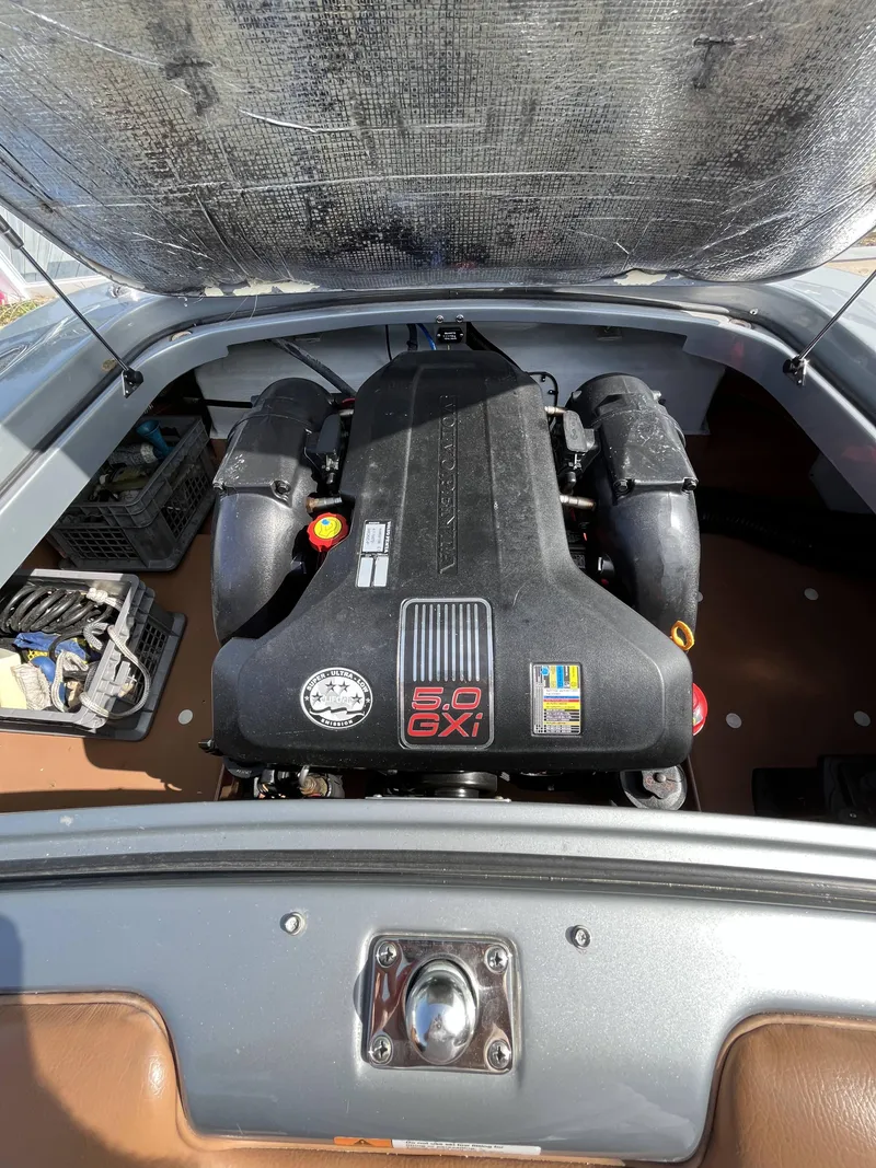Slide: The Image of 2011 Chris-Craft Silver Bullet 20 boat engine compartment with 5.0 GXI engine. - 17