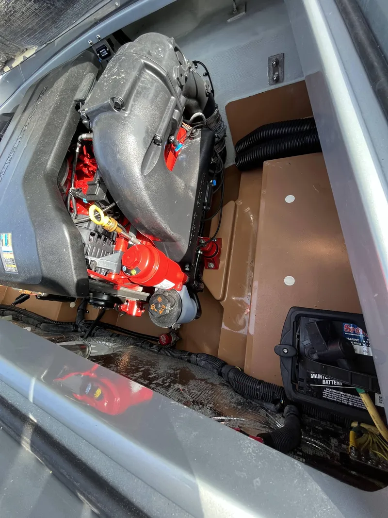 Slide: The Image of 2011 Chris-Craft Silver Bullet 20 engine compartment with visible components. - 19