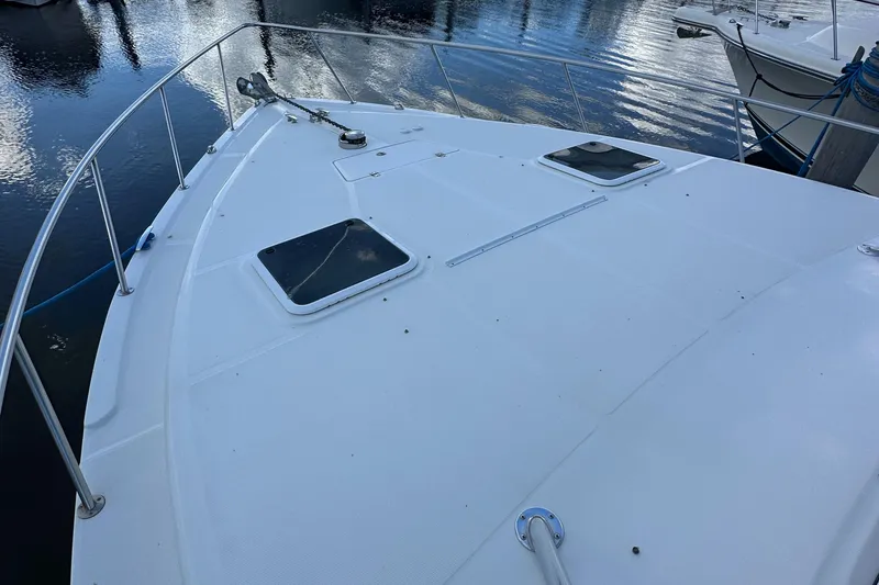 Slide: The Image of 2008 ProKat 3660 Sport Fish boat deck with hatches and railing. - 11