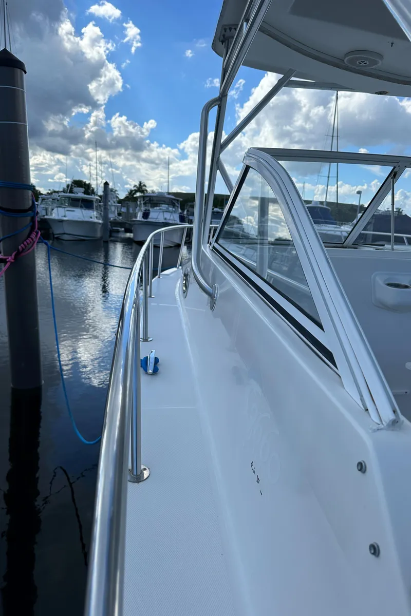 Slide: The Image of 2008 ProKat 3660 Sport Fish boat docked at a marina. - 13