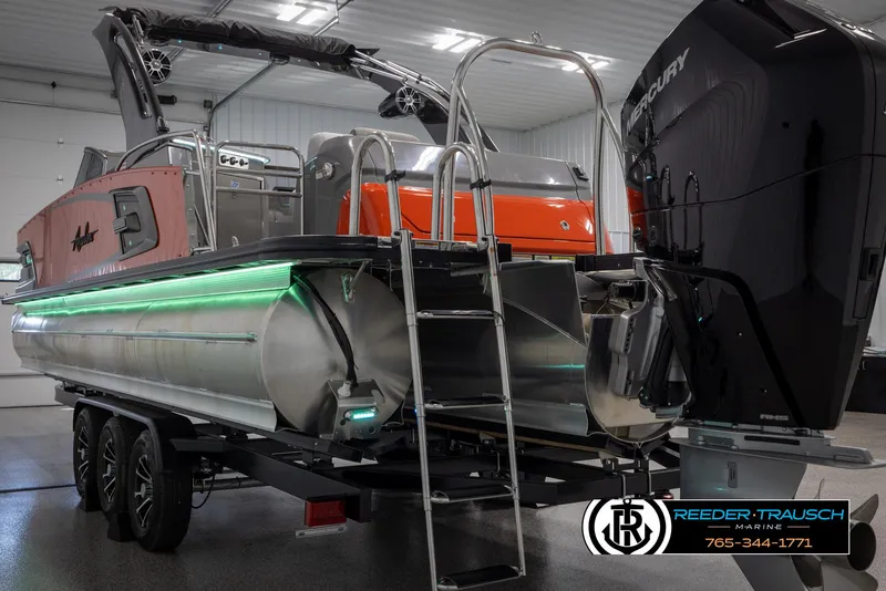 Slide: The Image of 2024 Avalon 2785 Excalibur EL pontoon boat with Mercury outboard engine. - 16