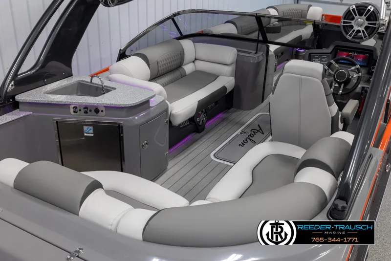 Slide: The Image of 2024 Avalon 2785 Excalibur EL luxury pontoon boat interior with plush seating and modern amenities. - 18