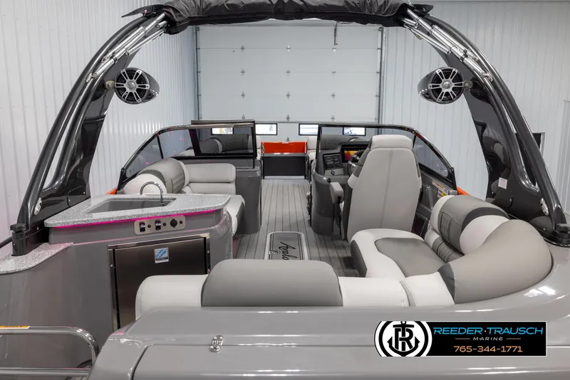 Slide: The Image of 2024 Avalon 2785 Excalibur EL luxury pontoon boat interior with modern seating and entertainment features. - 21