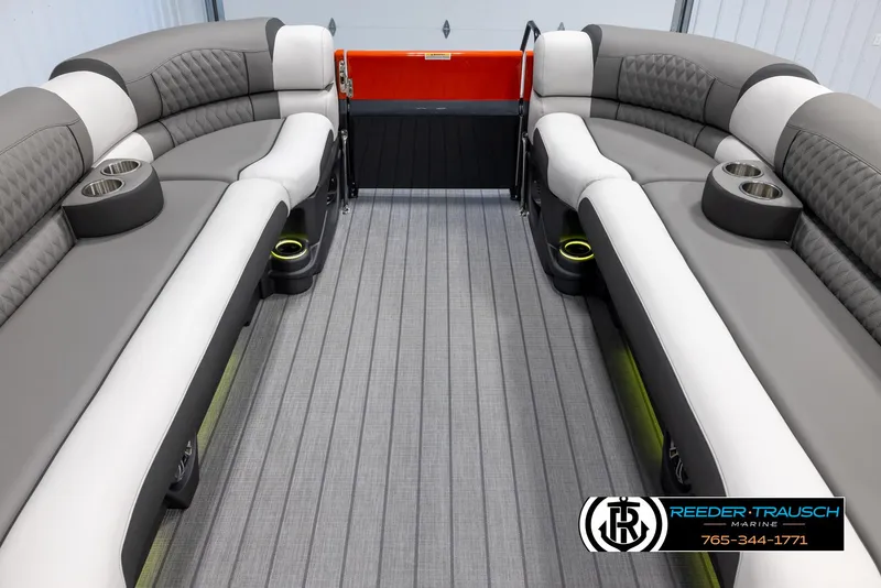 Slide: The Image of 2024 Avalon 2785 Excalibur EL interior with gray and white seating, cup holders, and flooring. - 25