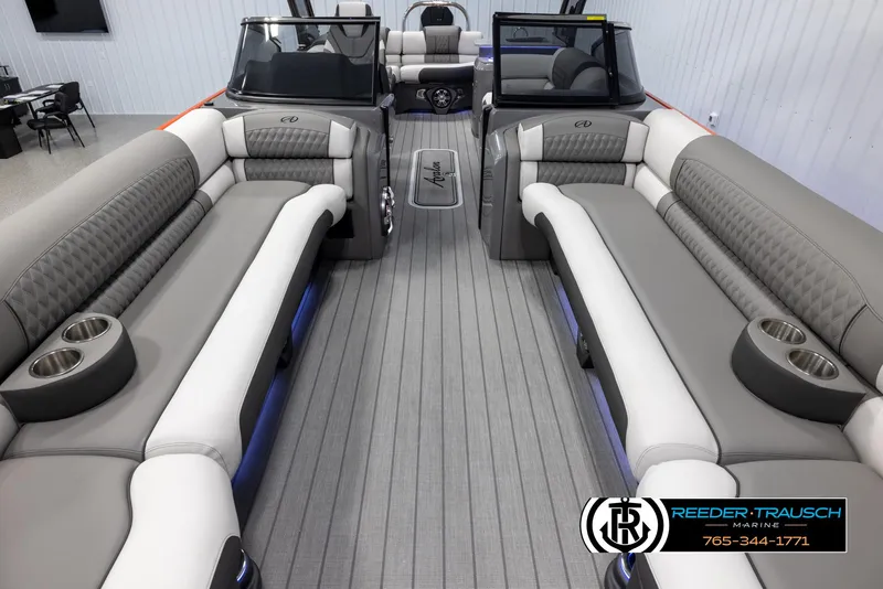 Slide: The Image of 2024 Avalon 2785 Excalibur EL pontoon boat interior with luxurious seating and cup holders. - 29