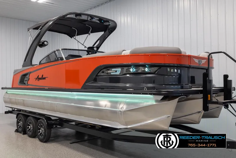 Slide: The Image of 2024 Avalon 2785 Excalibur EL pontoon boat in showroom. - 3