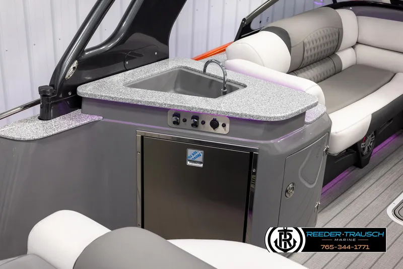 Slide: The Image of 2024 Avalon 2785 Excalibur EL boat interior with sink and seating area. - 38