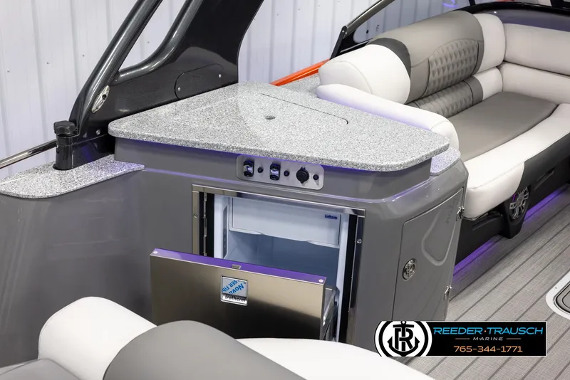 Slide: The Image of 2024 Avalon 2785 Excalibur EL boat interior with mini fridge and seating. - 40