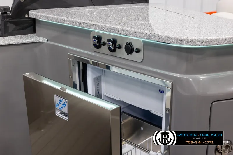 Slide: The Image of 2024 Avalon 2785 Excalibur EL boat interior with granite countertop and built-in refrigerator. - 41