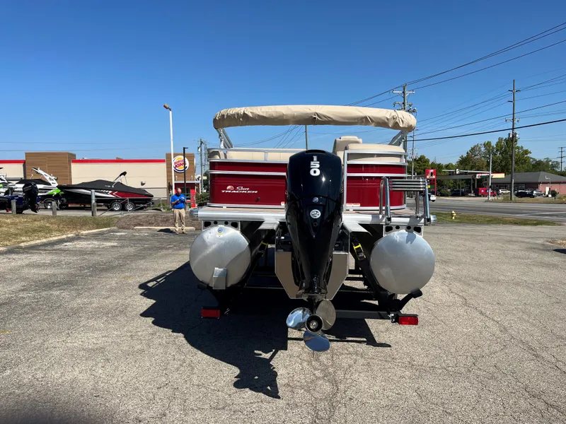 Slide: The Image of 2024 Sun Tracker Party Barge 22 RF XP3 pontoon boat with outboard motor in parking lot. - 15