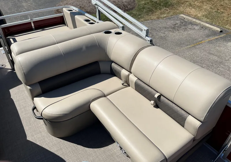 Slide: The Image of 2024 Sun Tracker Party Barge 22 RF XP3 with beige seating and cup holders. - 6