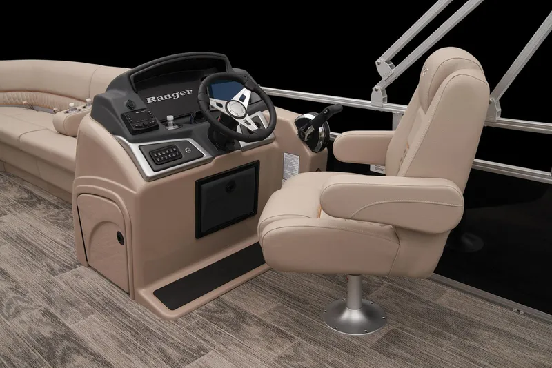 Slide: The Image of 2024 Ranger Reata 220C boat interior with beige captain's chair and control console. - 22
