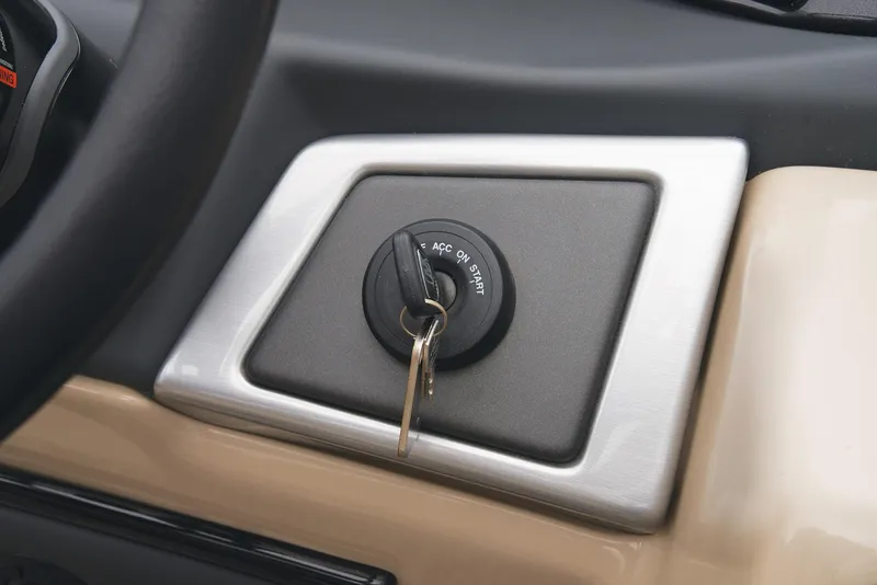 Slide: The Image of 2024 Ranger Reata 220C ignition switch with key inserted. - 35