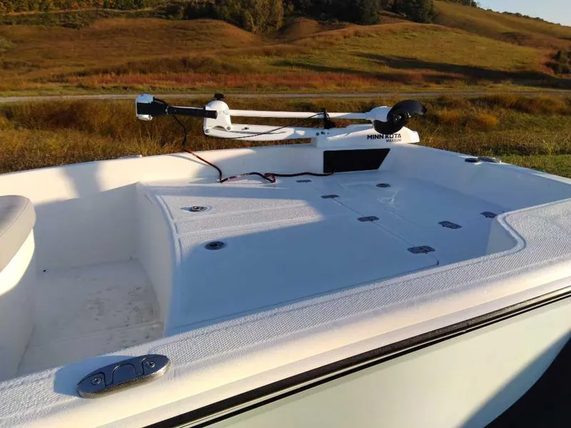 Slide: The Image of 2024 Mako Pro Skiff 15 CC boat deck with Minn Kota trolling motor. - 1